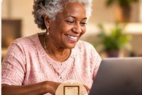 Older adult using a laptop